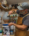 Peter Scheer (Omaha, NE) wearing copper pottery apron. 