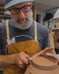 Peter Scheer (Omaha, NE) wearing copper pottery apron. 