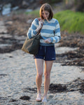 Knitwear designer Alicia Plummer carrying the Olive ARTIFACT Project Tote in Duck Canvas.