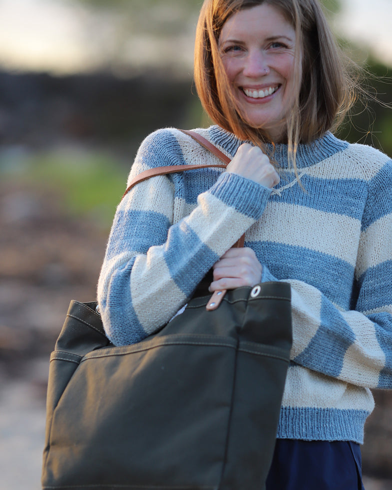 Knitwear designer Alicia Plummer carrying the Olive ARTIFACT Project Tote in Duck Canvas.